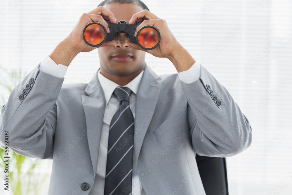 Businessman looking through binoculars Businessman looking through binoculars