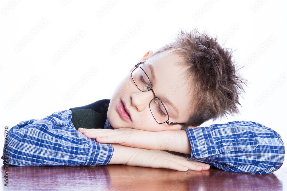 Sleeping boy on the table Sleeping boy on the table