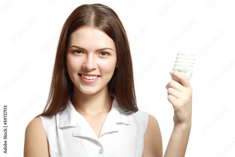 woman holding energy saving lamp woman holding energy saving lamp