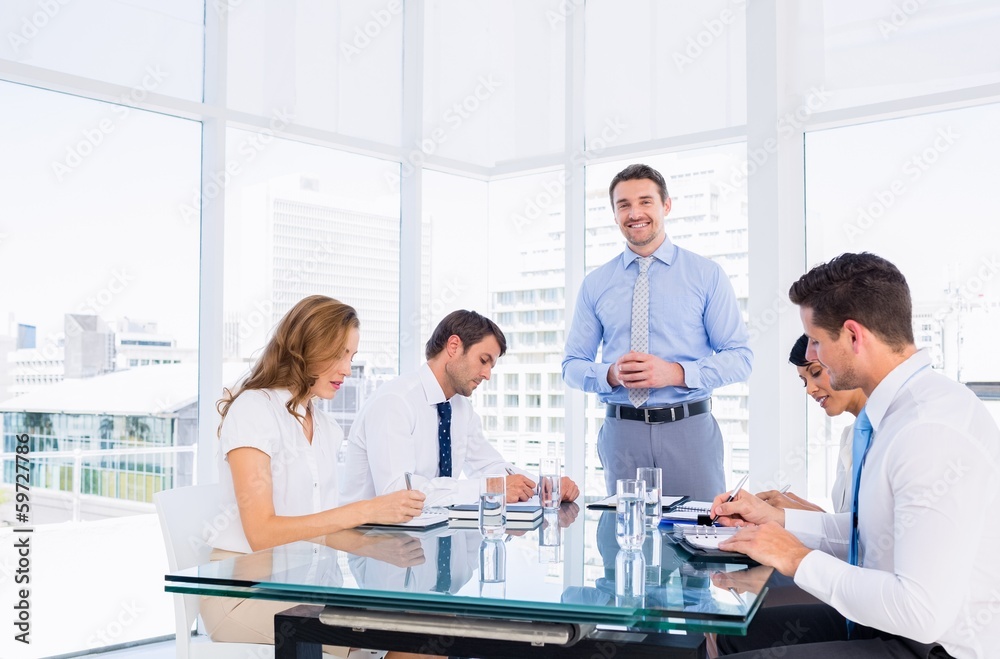 Executives sitting around conference table Executives sitting around conference table
