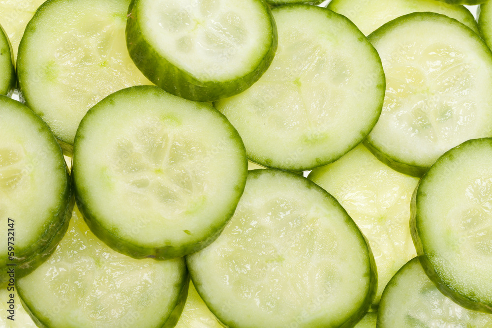 Freshly sliced cucumber isolated on white background Freshly sliced cucumber isolated on white background
