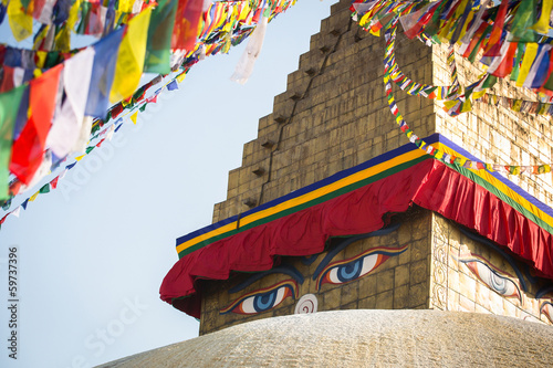 Bodhnath Stupa in Kathmandu with Buddha Eyes and prayer flags.