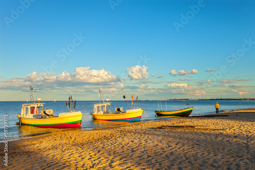 Fishing boats in Sopot with port in the background, Poland.