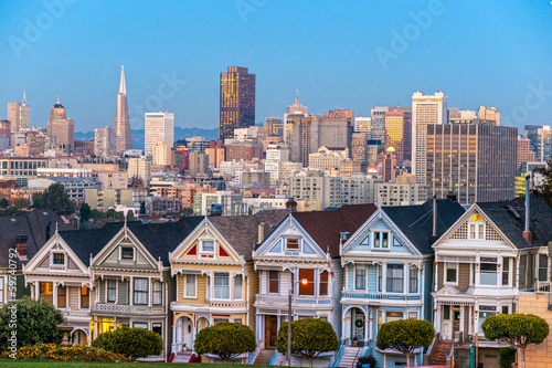 The Painted Ladies of San Francisco, California sit glowing amid