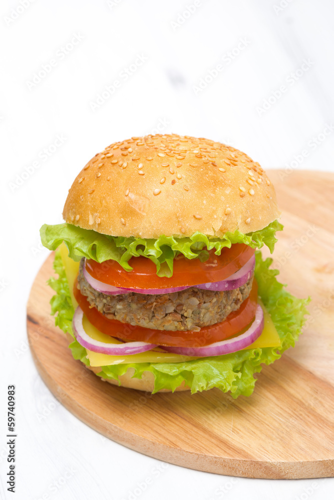 Burger with a vegetarian cutlet and fresh vegetables Burger with a vegetarian cutlet and fresh vegetables