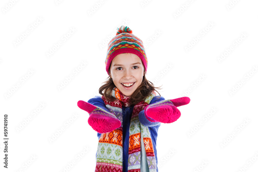 Beautiful little girl in cap and scarf