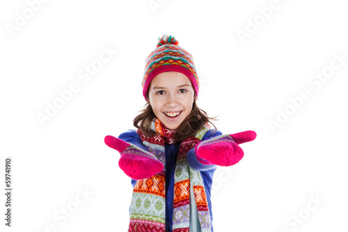Beautiful little girl in cap and scarf