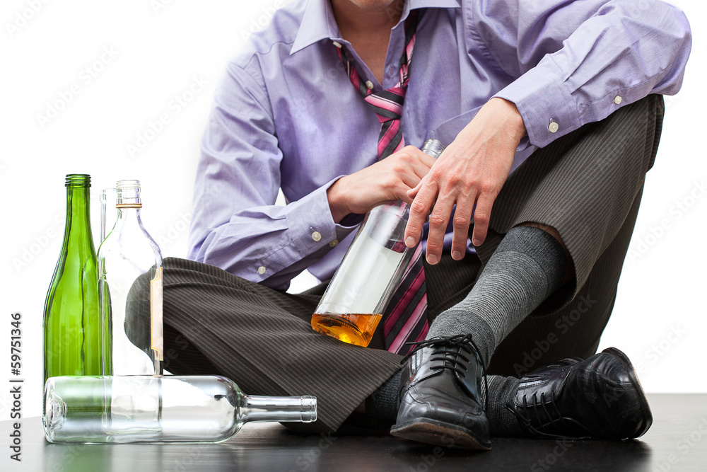 Fototapeta premium Depressed businessman drinking alcohol