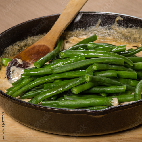 Preparing green beans to make a casserole photo