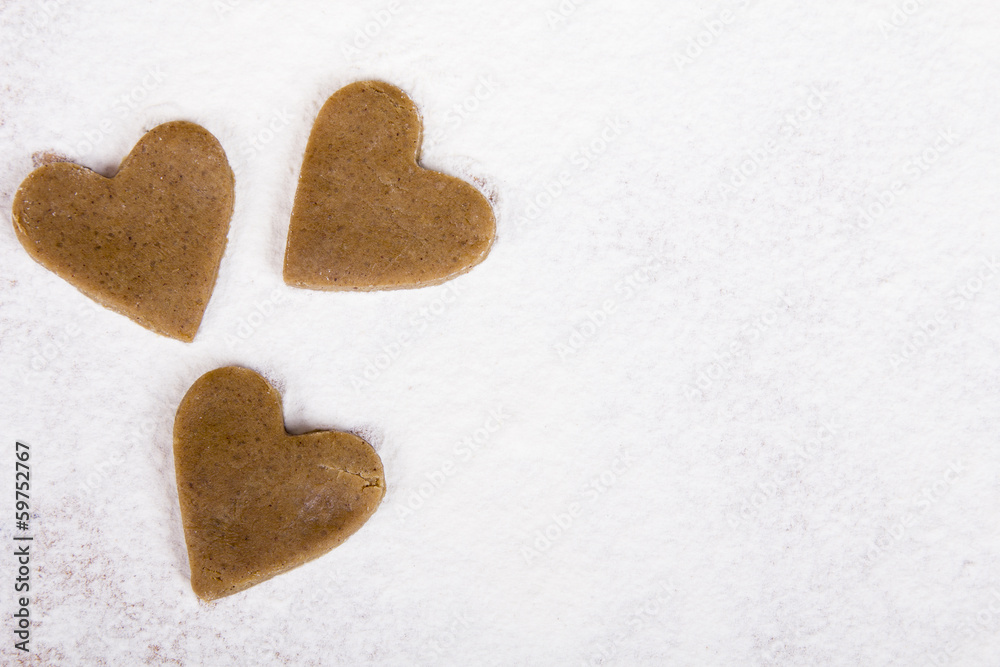 Obraz premium raw gingerbread hearts - baking background