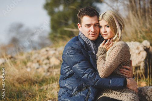 portrait of a young couple on a background of mountains