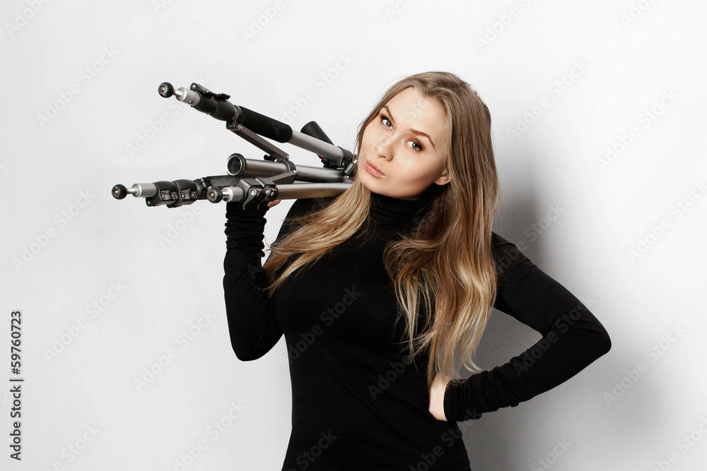 Girl with tripod on white background