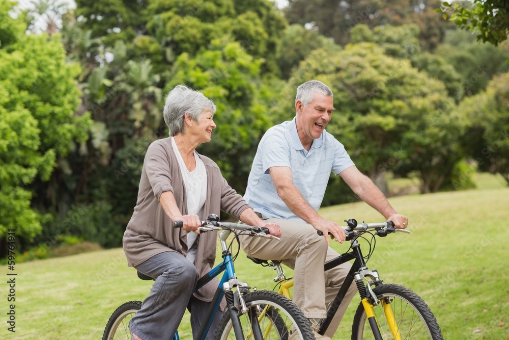 Senior couple on cycle ride in countryside Senior couple on cycle ride in countryside