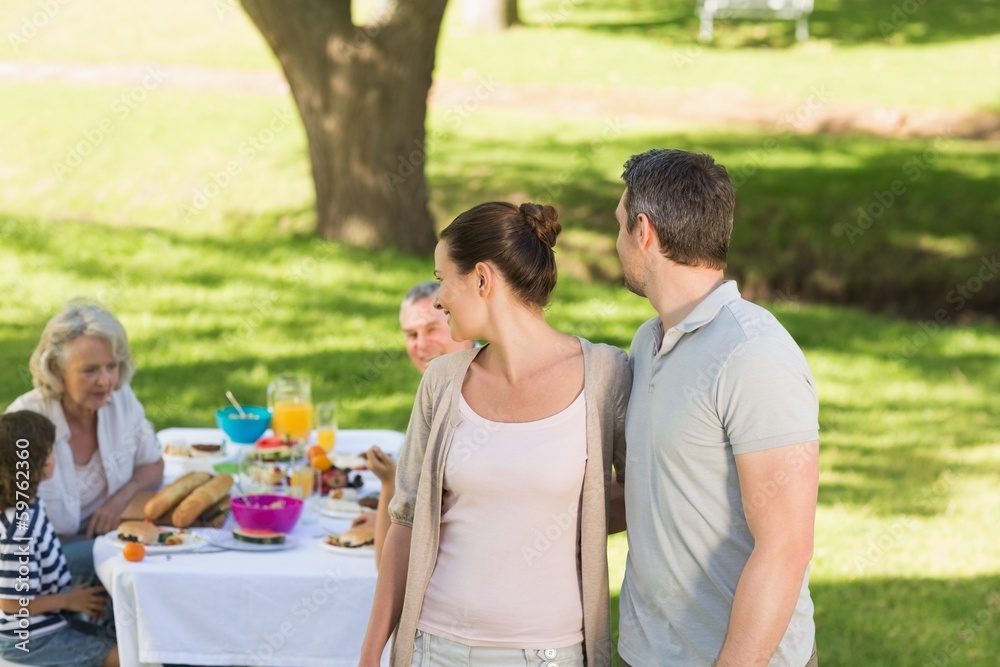 Couple with family dining at outdoor table Couple with family dining at outdoor table