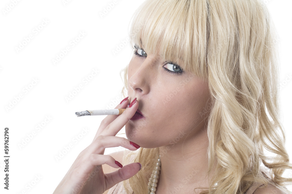 Fototapeta premium Young Woman Smoking a Cigarette
