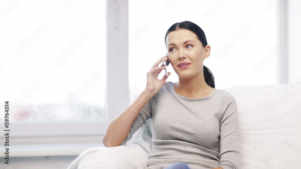 smiling woman with smartphone at home smiling woman with smartphone at home