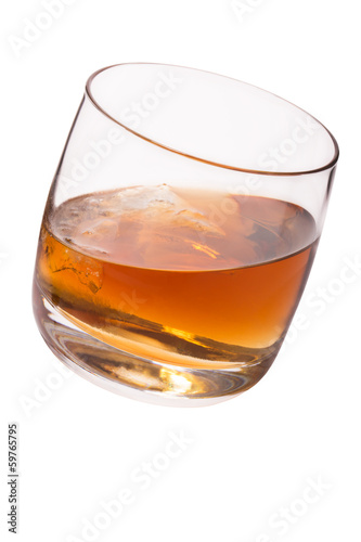 Glass with whiskey and ice isolated on white background
