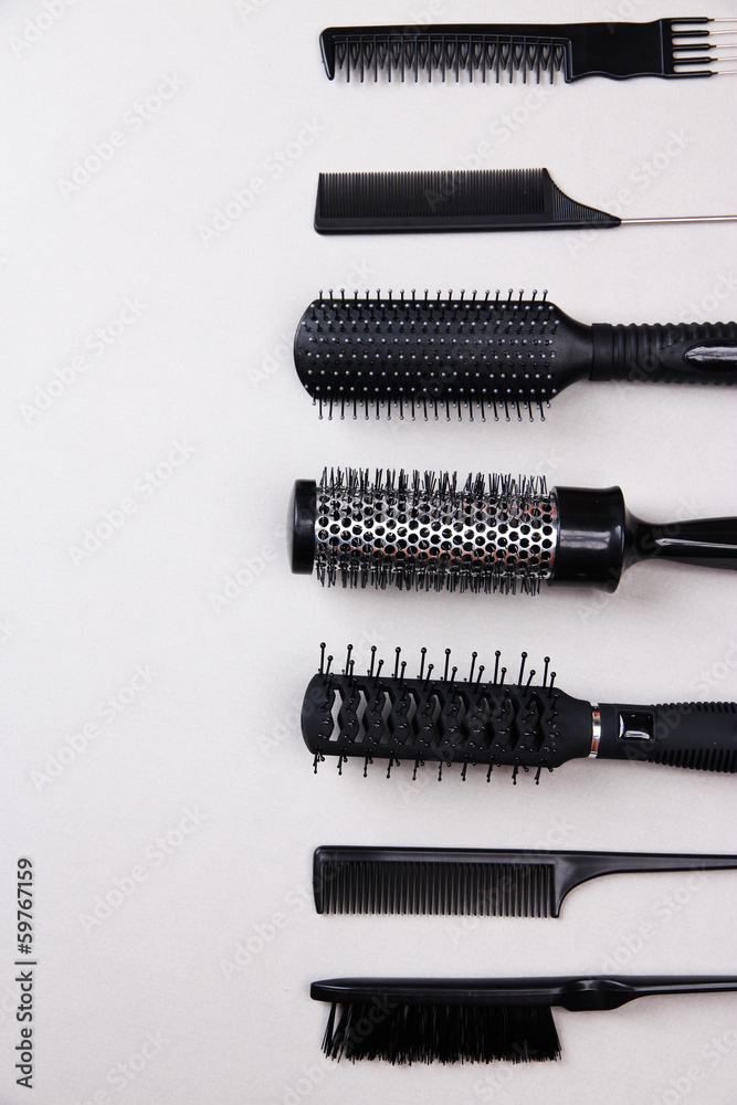 Black combs on gray background