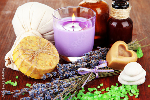 Fototapeta Naklejka Na Ścianę i Meble -  Still life with lavender candle, soap, massage balls, bottles,