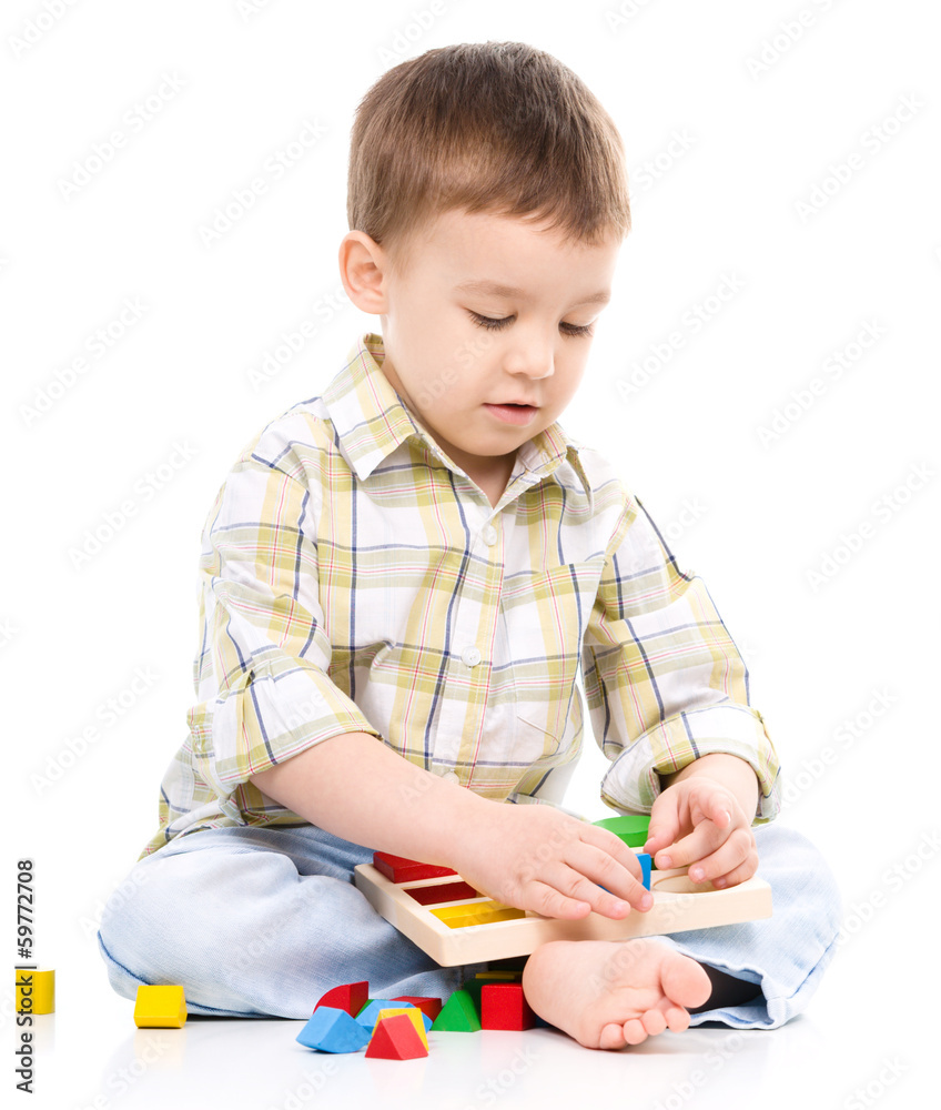 Little boy is playing with toys Little boy is playing with toys
