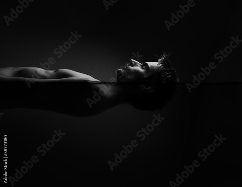 Man Floating In A Sensory Deprivation Isolation Tank photo