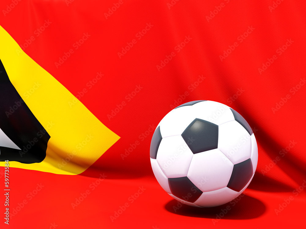 Naklejka premium Flag of east timor with football in front of it