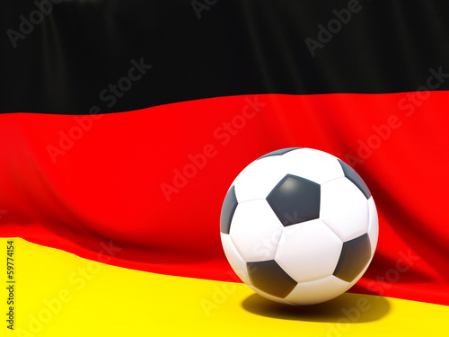 Flag of germany with football in front of it