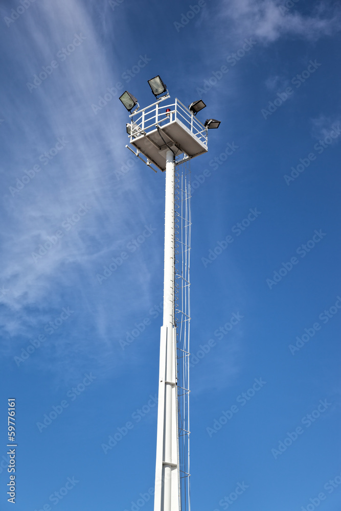 Lighting tower against a clear blue sky. Lighting tower against a clear blue sky.