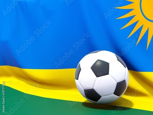 Flag of rwanda with football in front of it