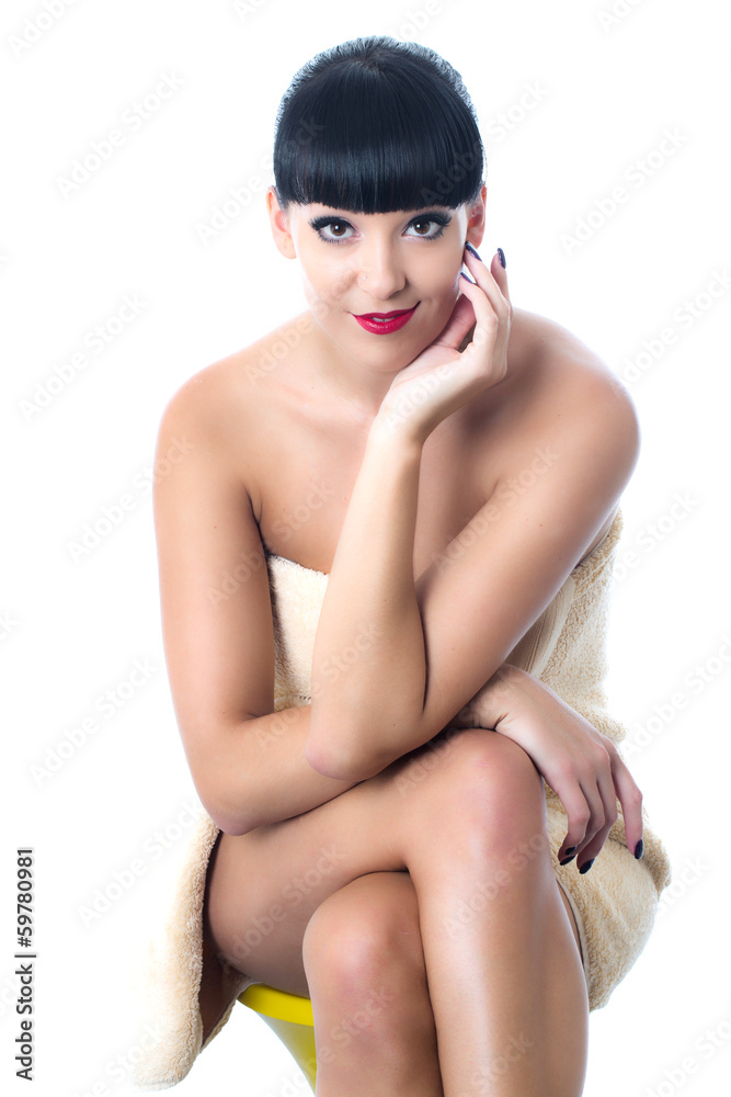 Fototapeta premium Thoughtful Young Woman Wearing a Towel