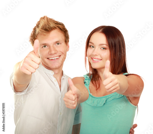 Young happy couple showing ok, isolated on white background