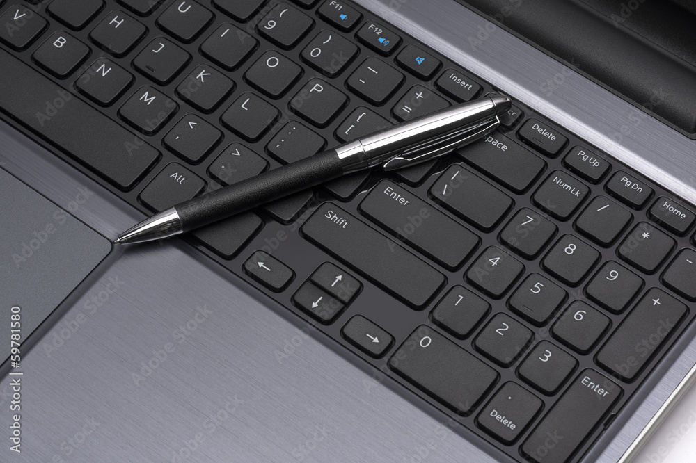 laptop with a pen