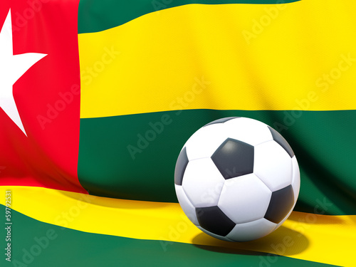 Flag of togo with football in front of it