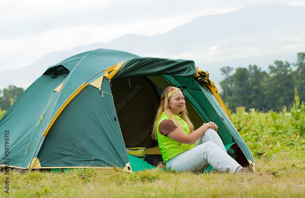  tourist in front camp tent