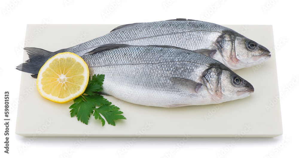Fresh sea bass on plate isolated on white background