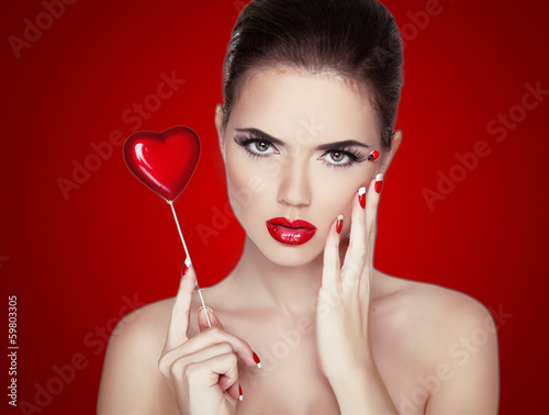 Beauty Woman Portrait. Professional Makeup for Brunette with Red