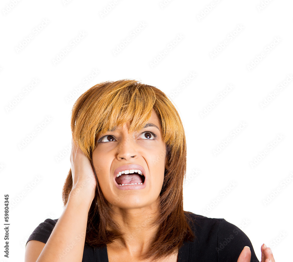 Portrait stressed young woman looking up screaming Portrait stressed young woman looking up screaming