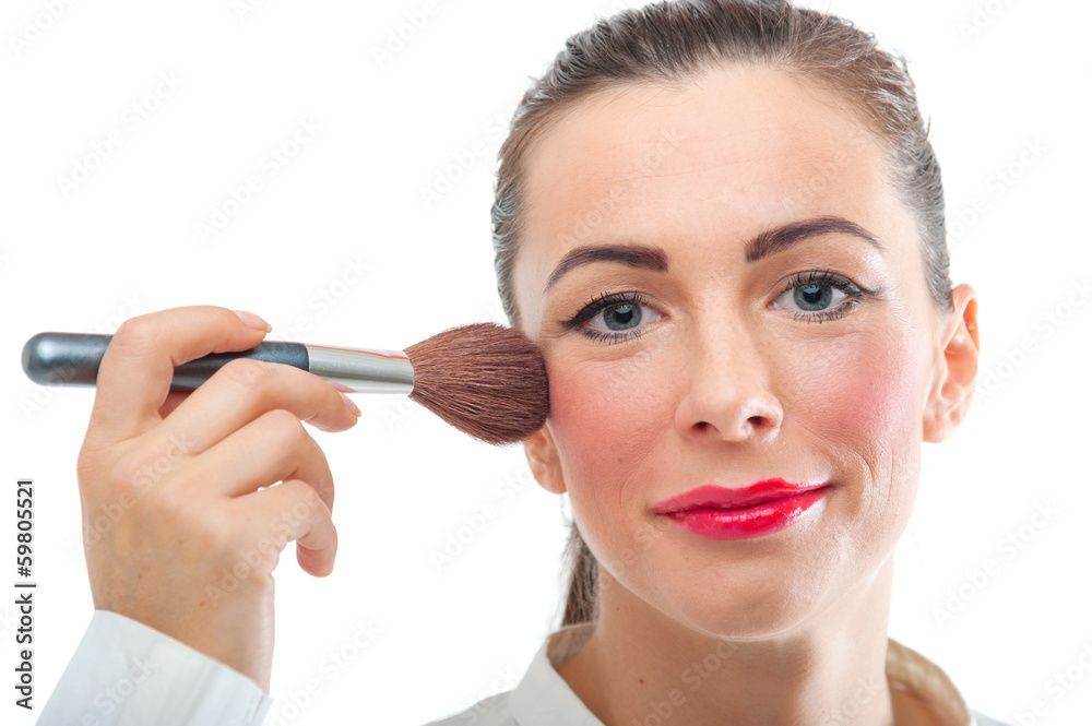 Pretty smiling woman applying make up Pretty smiling woman applying make up