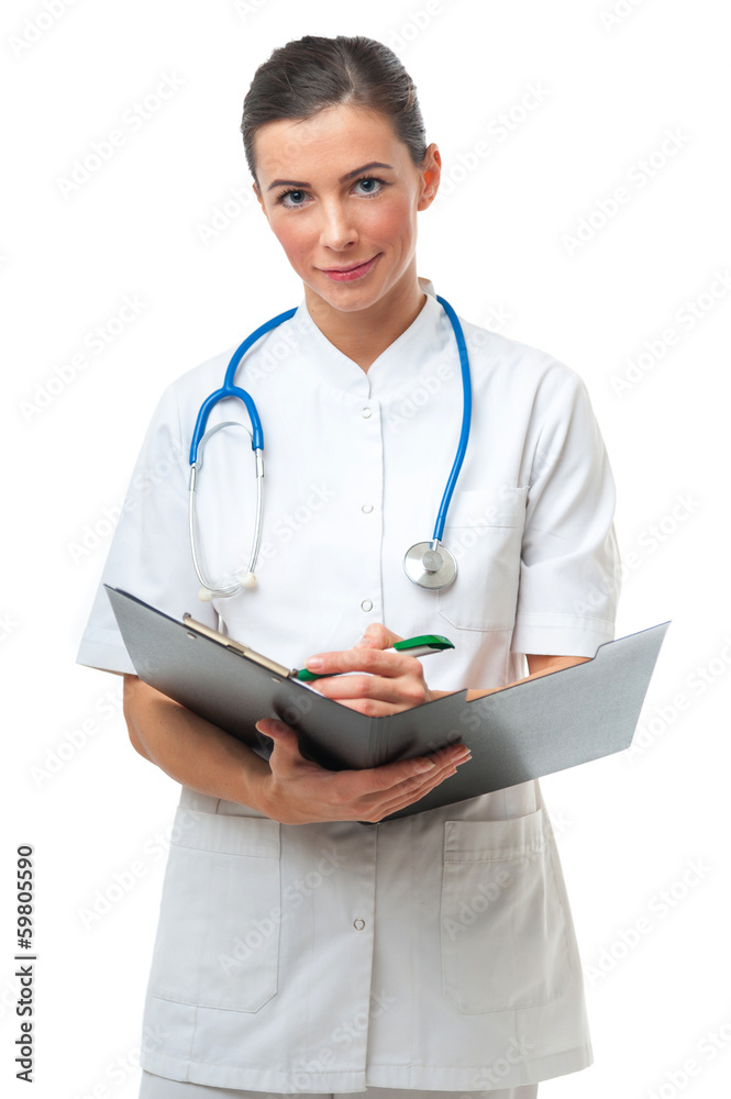 Smiling Female doctor make a note on clipboard Smiling Female doctor make a note on clipboard