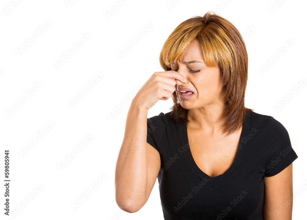 Woman pinches her nose, something stinks, very bad smell Woman pinches her nose, something stinks, very bad smell