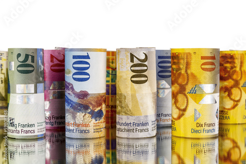 Swiss franc, banknotes rolled up in rolls