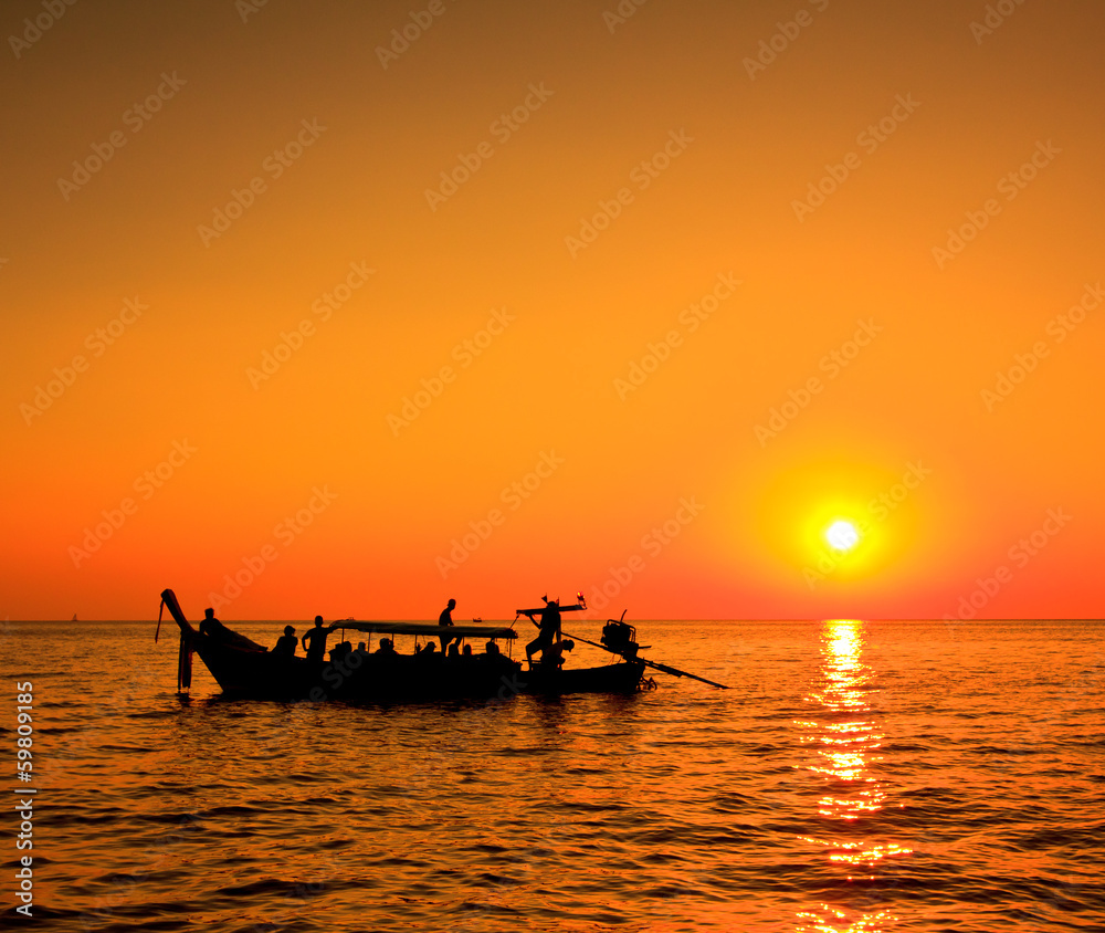 Longtail boat in the sunset, Andaman sea, South of Thailand