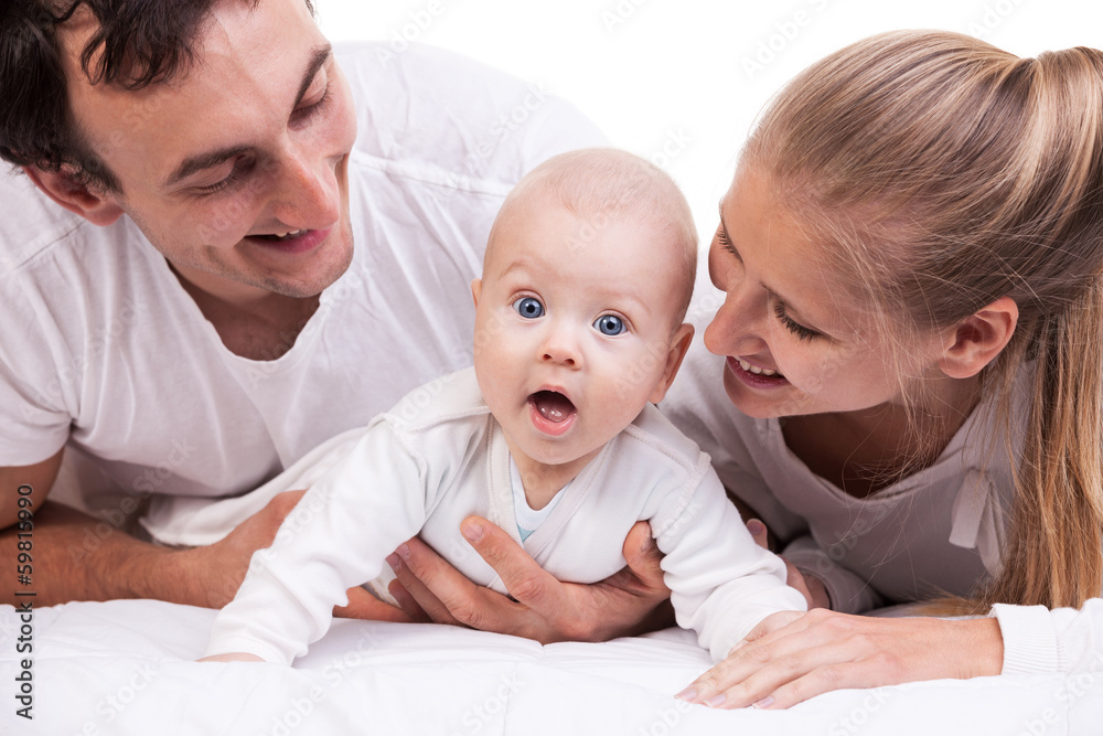 Closeup of young family with baby boy against white Closeup of young family with baby boy against white