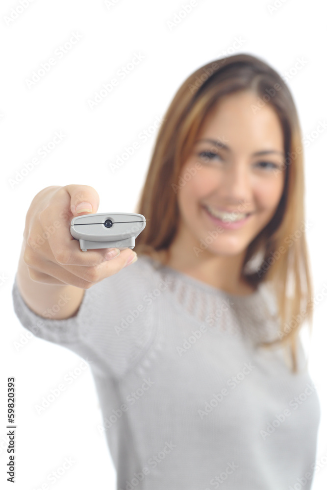 Woman pushing a button on a remote control Woman pushing a button on a remote control