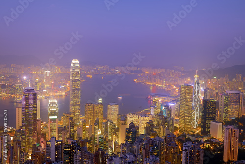 Hong Kong city skyline panorama at night with Victoria Harbor an © xiaoliangge
