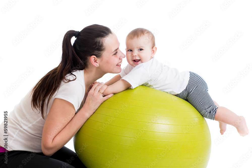 Fototapeta premium mother and baby having fun with gymnastic ball