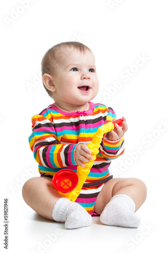 baby girl playing musical t...