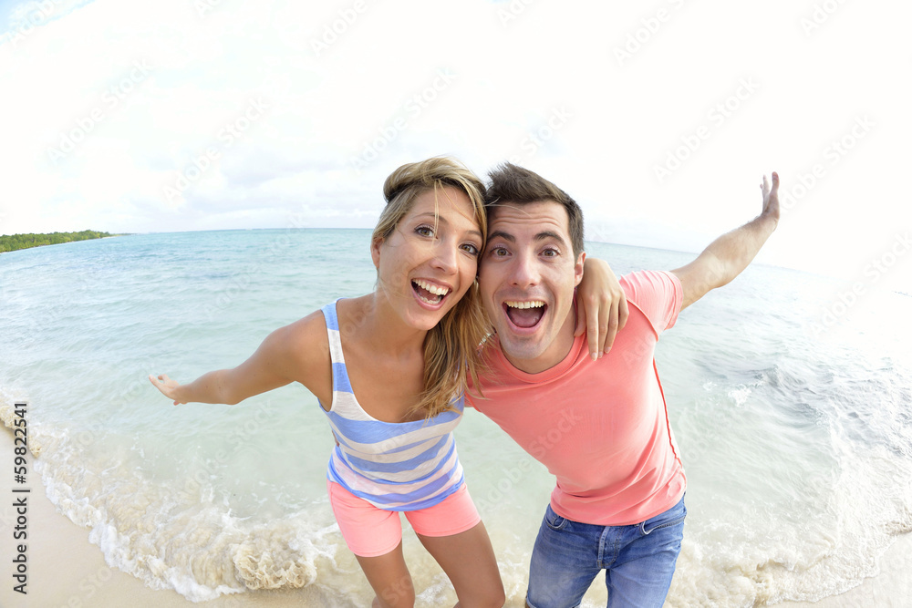 Couple having fun at the beach Couple having fun at the beach