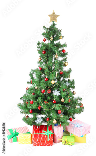 Decorated Christmas tree with gifts isolated on white © Africa Studio