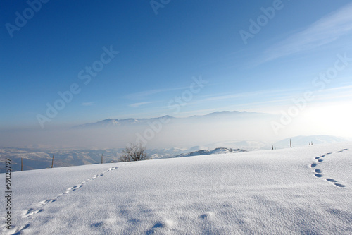 Mountain horizon, Foot steps on the snow